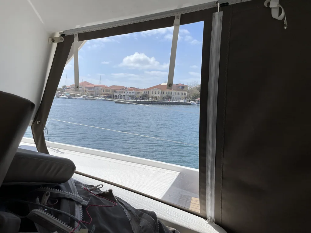 Side panel framing the harbour from inside the cockpit