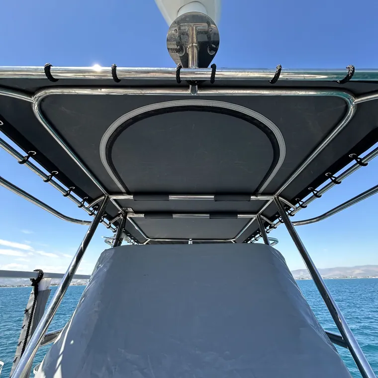 Bimini frame over the cockpit with open sea astern