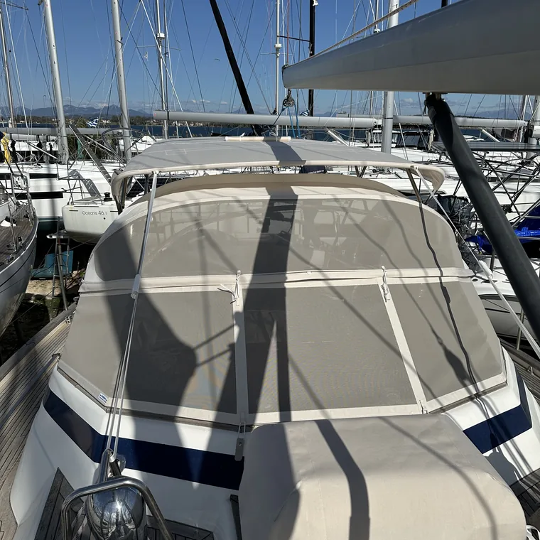 Cream sprayhood with navy trim, seen from the bow