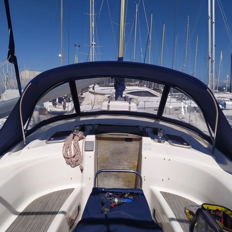 Navy sprayhood and bimini seen from the foredeck of a sailing yacht