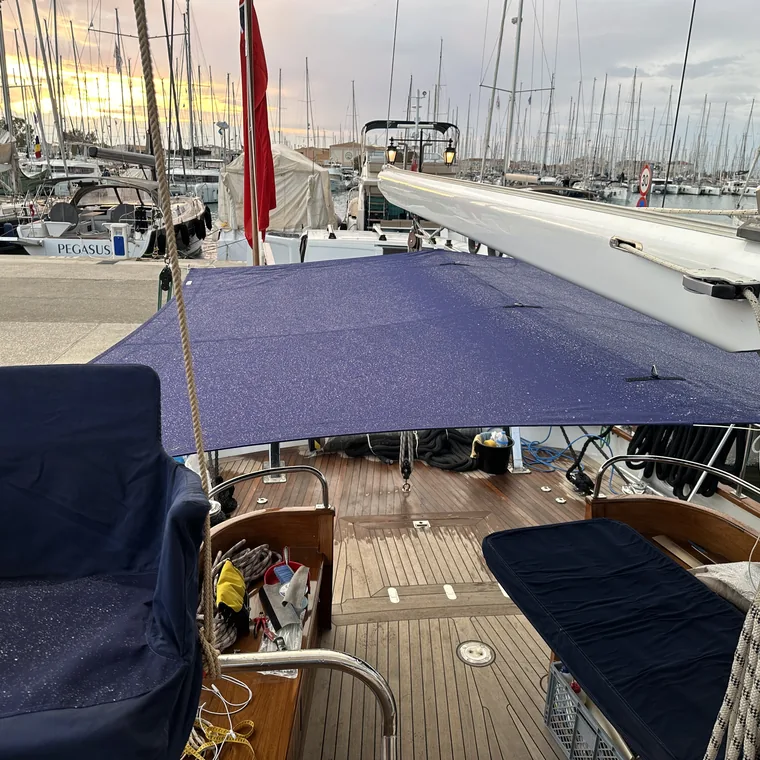 Navy awning shading the deck of a classic yacht