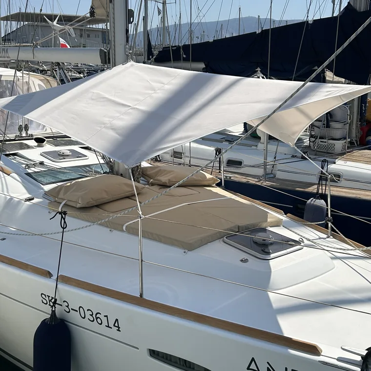 White awning rigged over the side deck of a yacht