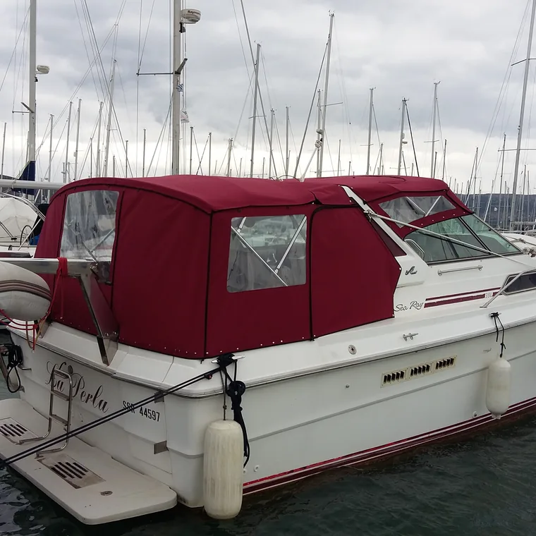 Red cockpit enclosure on a motor boat lying at her berth