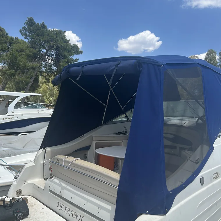 Navy cockpit enclosure under a bright sky