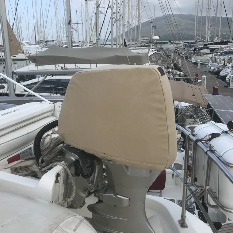Tan cover over the wheel and pedestal, the marina behind