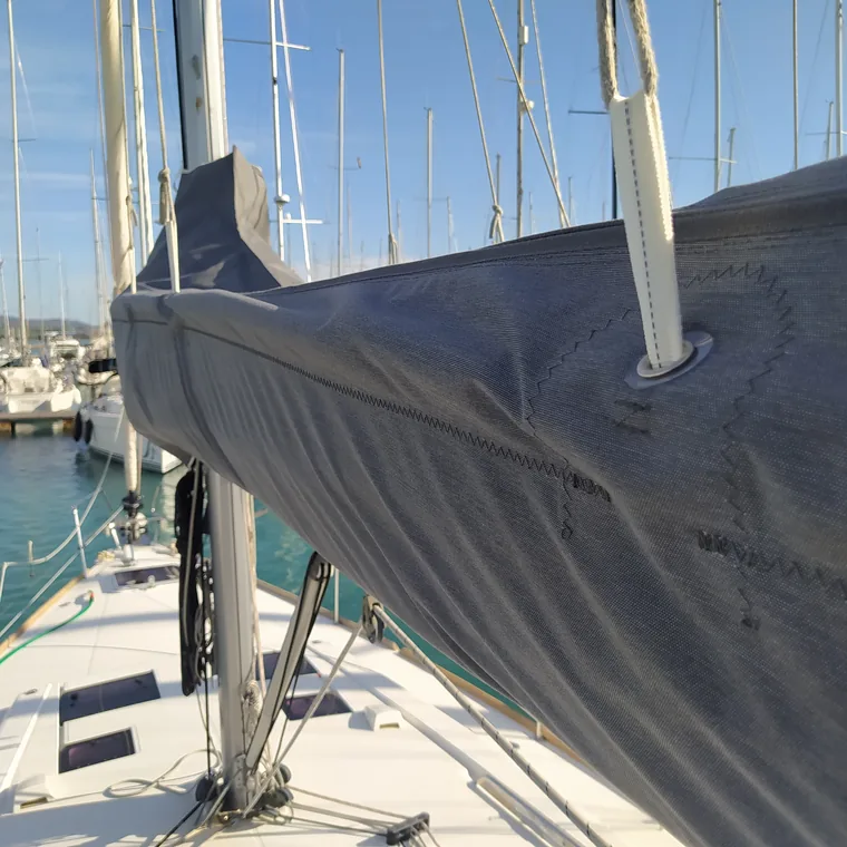 Dark lazy bag on the boom against open water