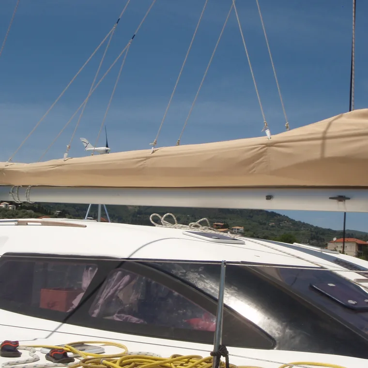 Tan lazy bag on the boom, the hills of the bay behind