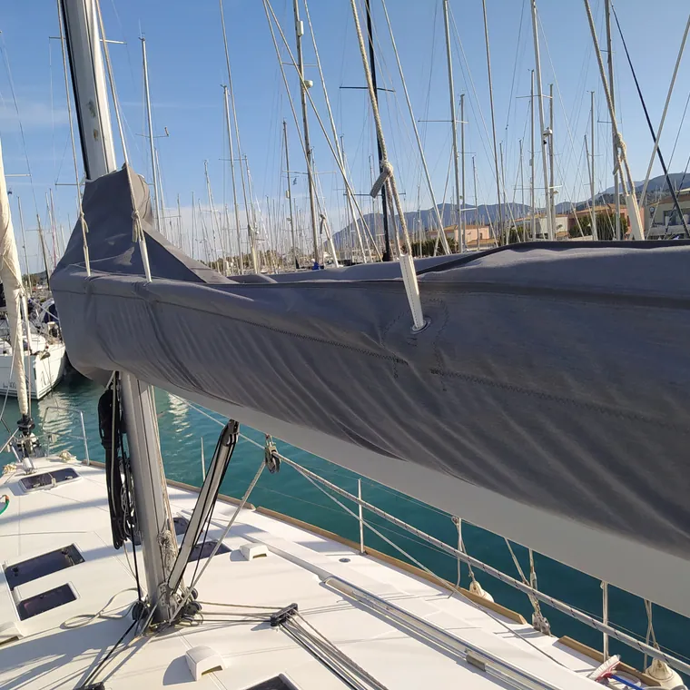 Grey lazy bag on the boom of a yacht in her berth