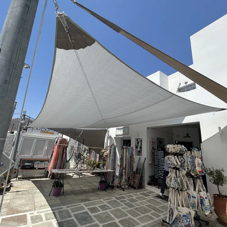 Row of white sails shading a paved courtyard