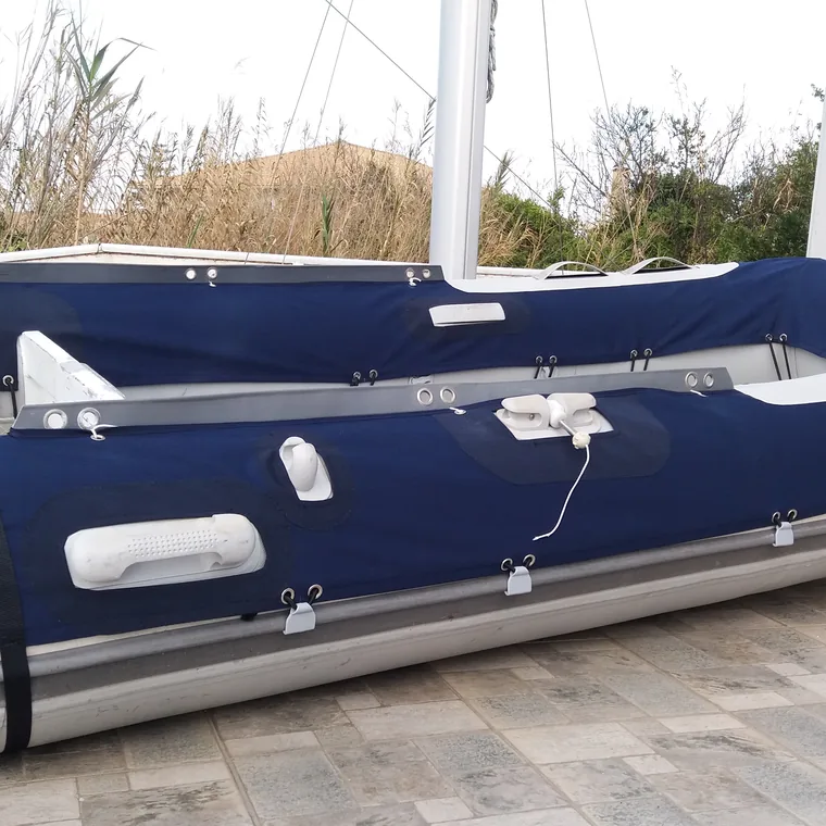 Navy cover fitted over a RIB on its trailer