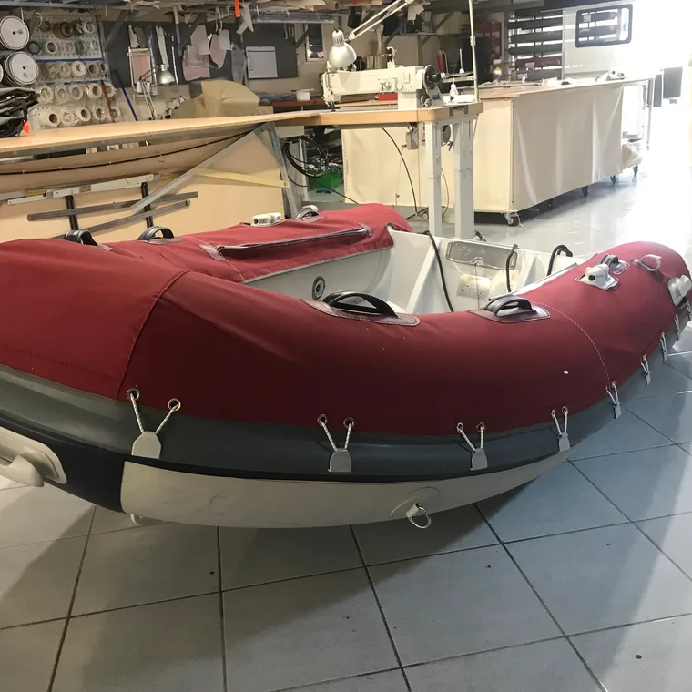 Red tube covers on a RIB, ready to leave the workshop
