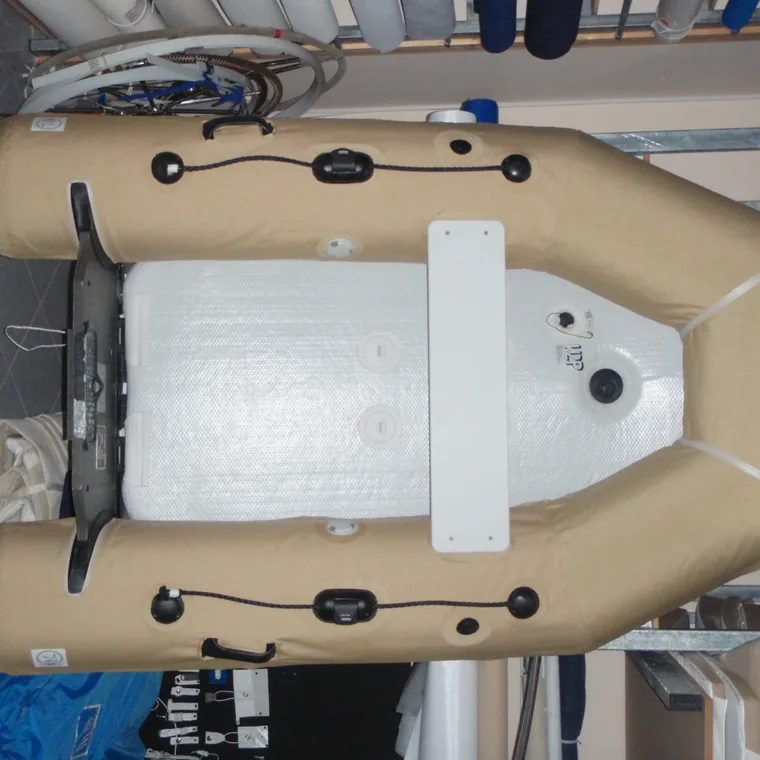 Tan tube covers on a RIB under the workshop lights