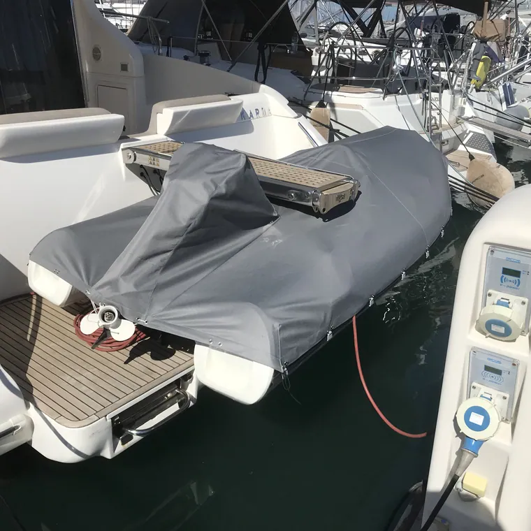 Tenders covered and stowed on the davits of a yacht