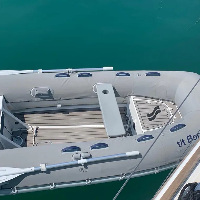 Navy RIB seen from above on green water
