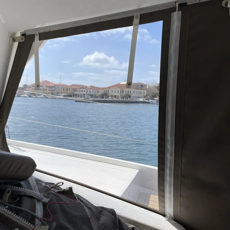 Side panel framing the harbour from inside the cockpit