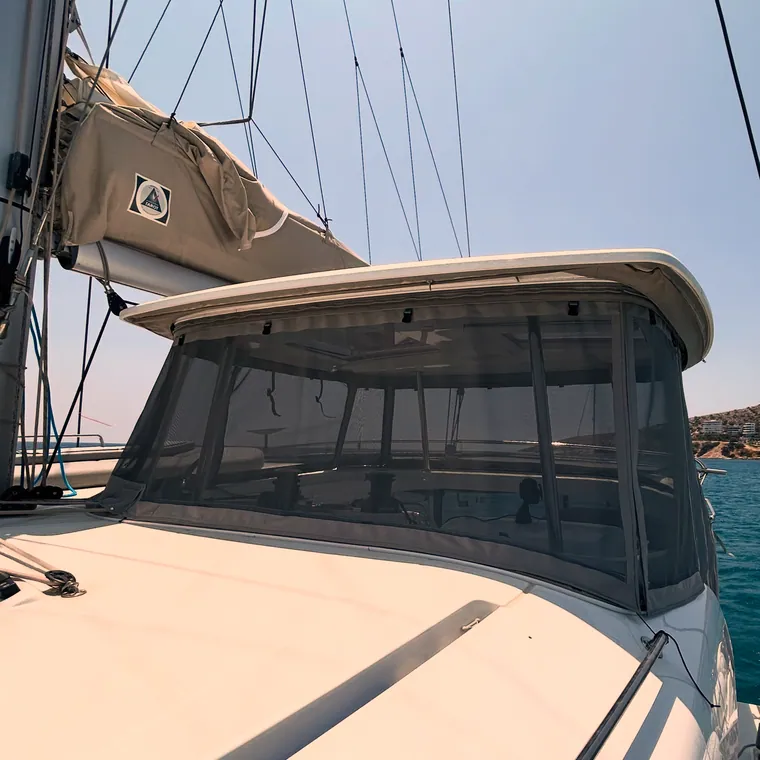 Tan side panel and sprayhood on a motorboat at her berth
