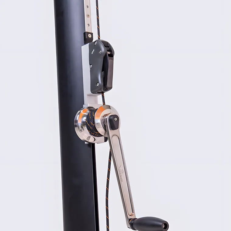 A crank winch and its scale mounted on a black pole