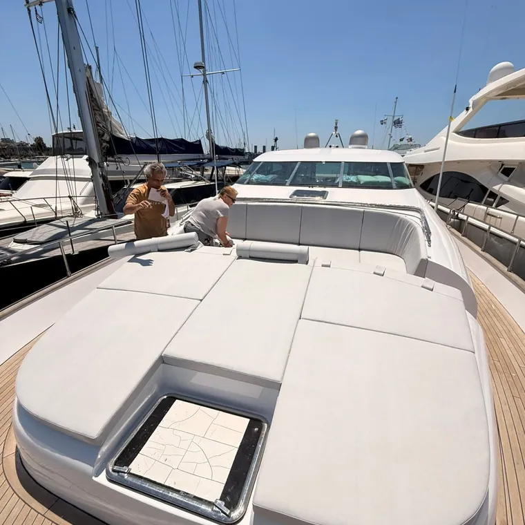 Sunpad cushions on the foredeck under a bimini