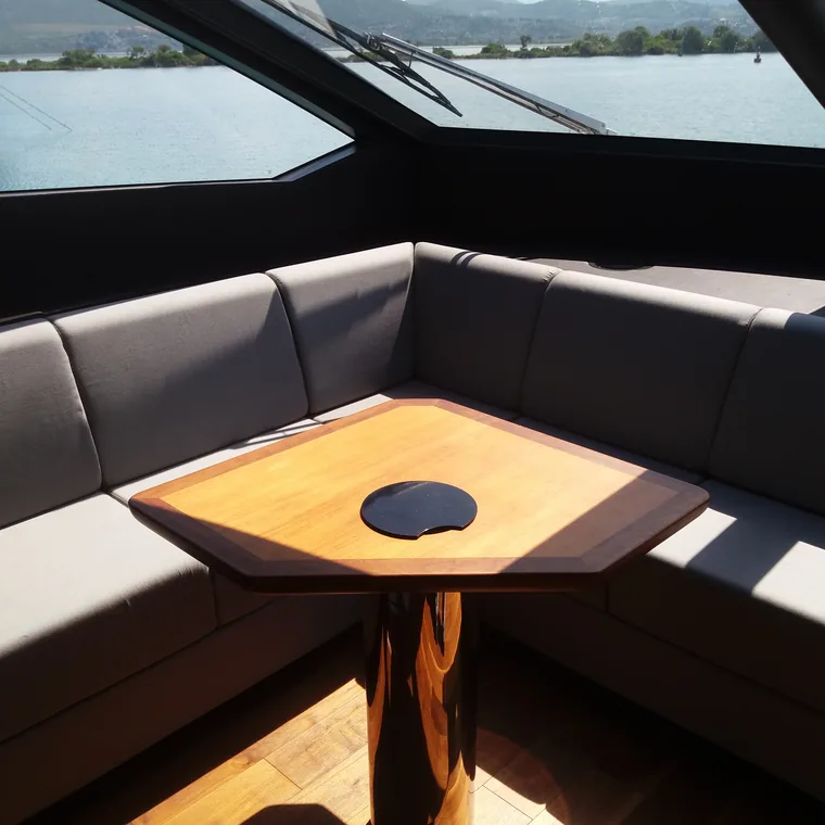 Corner settee and table in a motor yacht's saloon