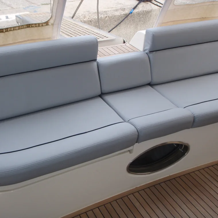 Pale grey cockpit sofa on a motor yacht