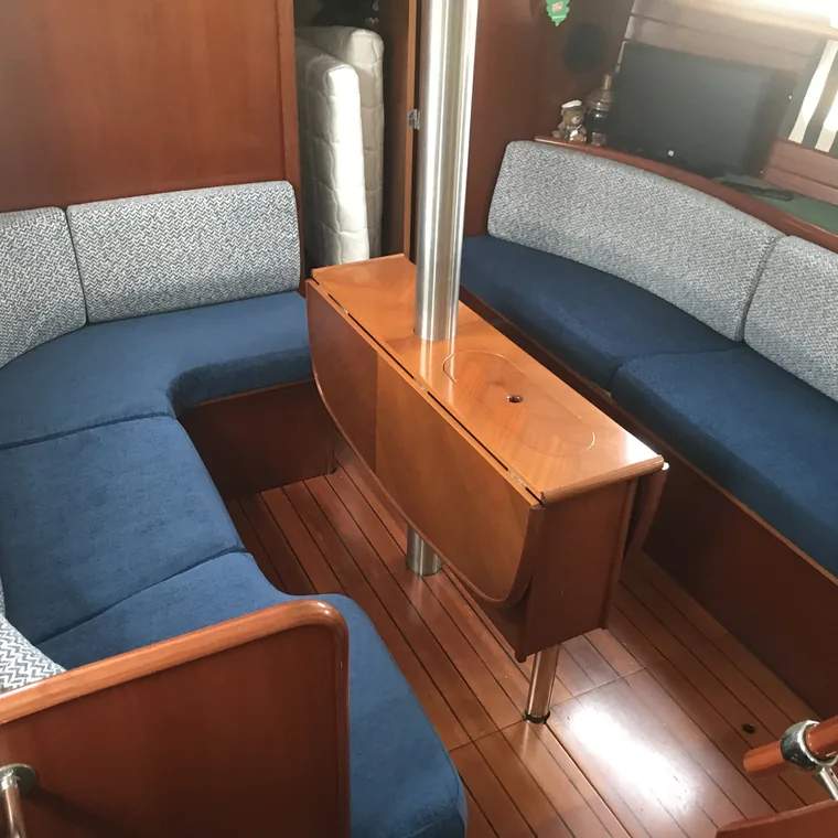 Blue and cream saloon settee in a timber interior