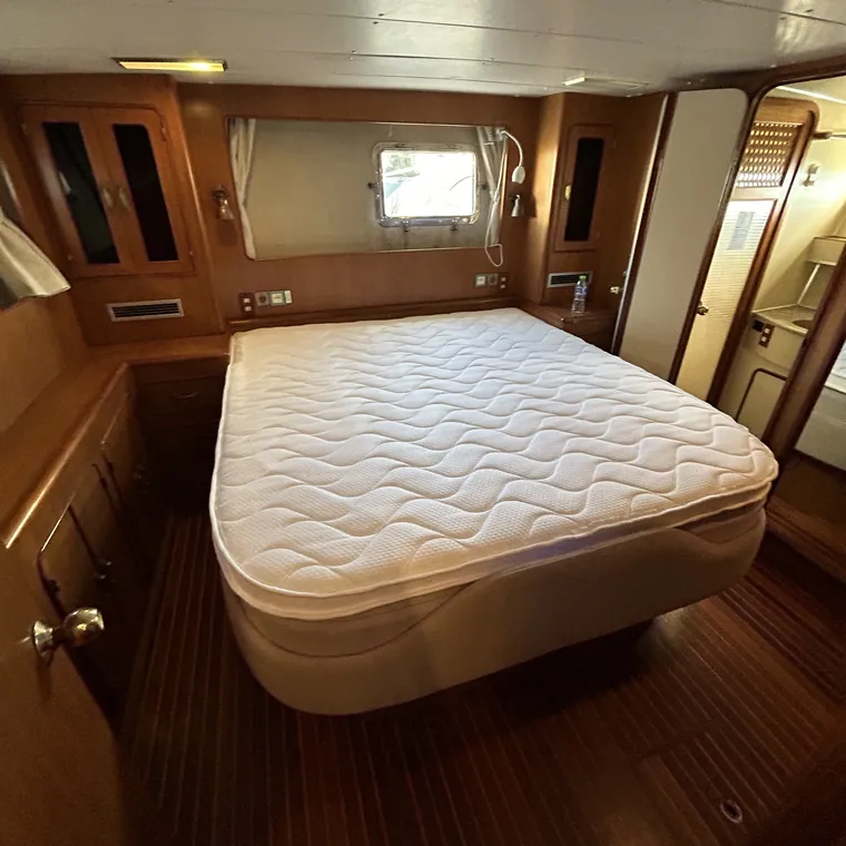 Quilted cabin mattress in a varnished timber cabin