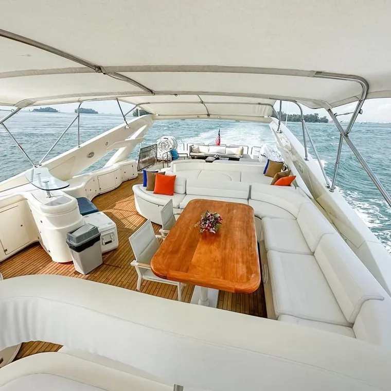 Cockpit table and cushions on a yacht at anchor