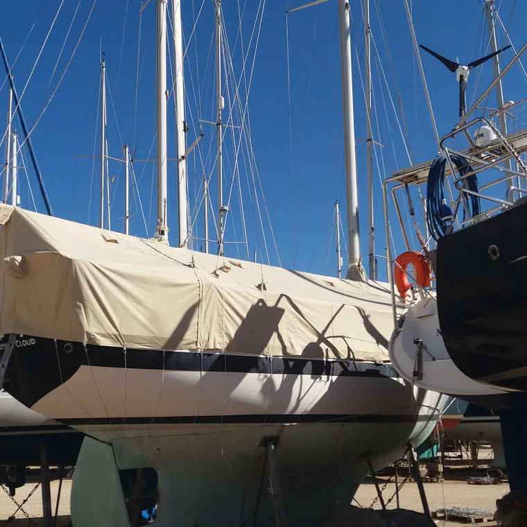 Tan winter cover on a yacht standing in the yard