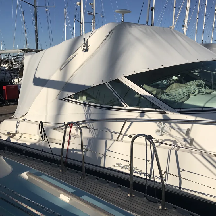 White winter cover on a yacht, the mountains behind