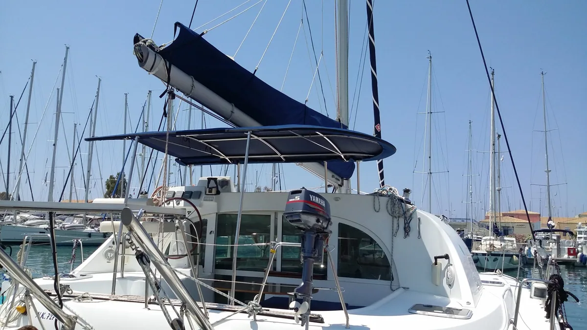 Yachts moored in an Attica marina with biminis fitted