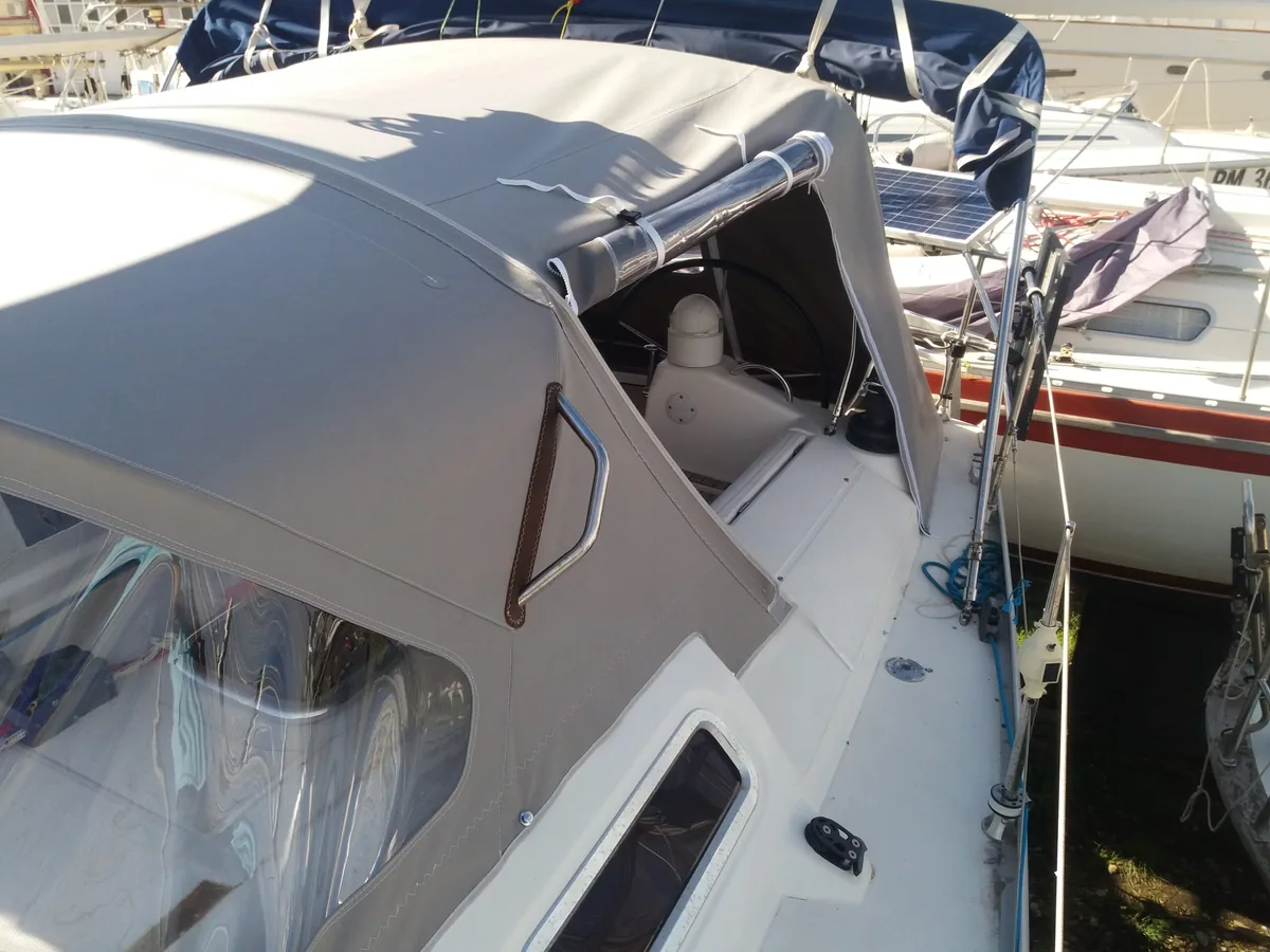 Grey enclosure with clear panels closing in the cockpit of a yacht