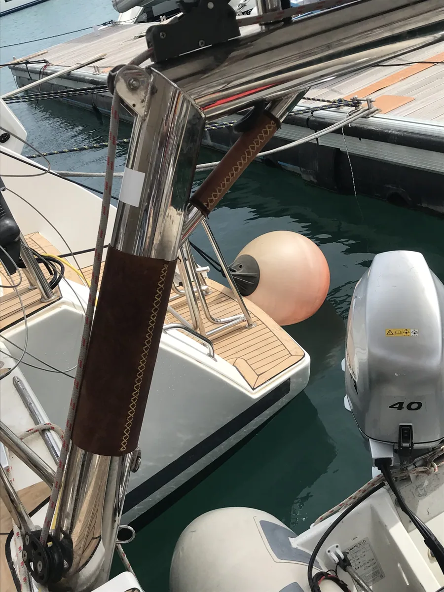 Leather wrapped and stitched around a stainless post at a boat's stern