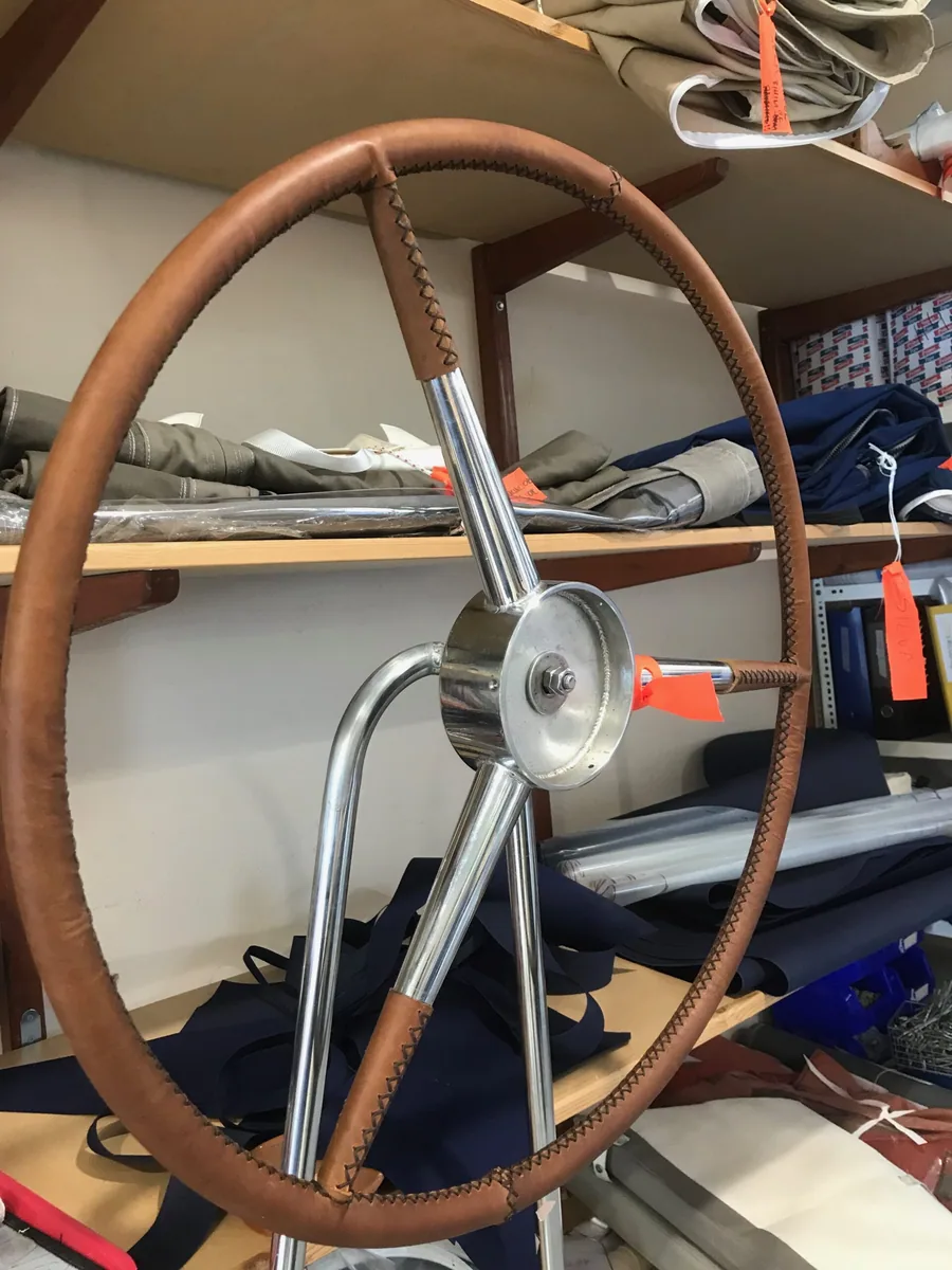 Leather-covered steering wheel on the bench in the workshop