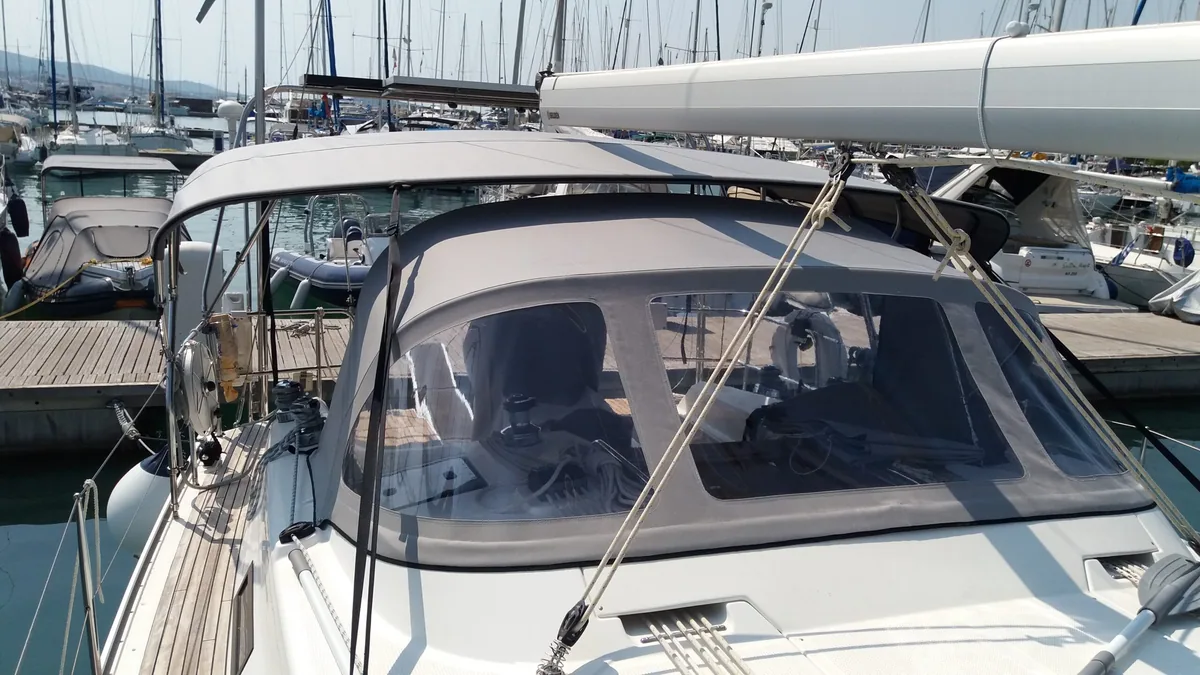 Sprayhood and bimini fitted on a sailing yacht in a crowded marina