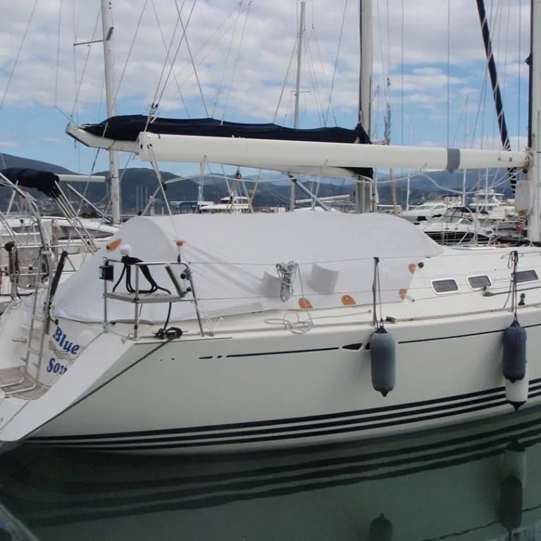Navy boom cover and dodger on a yacht lying in a marina berth