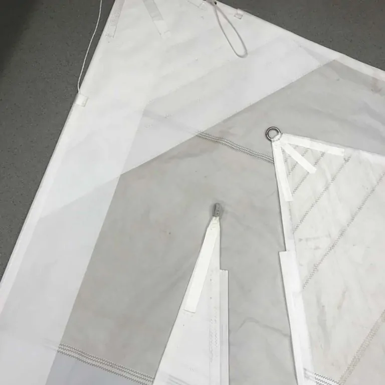 Two panels overlapping on the workshop floor before the seam is closed